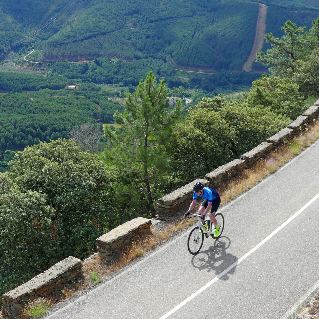 Valley Descent – Trans Iberian 600k Cyclist descending into a scenic valley during the Trans Iberian 600k.