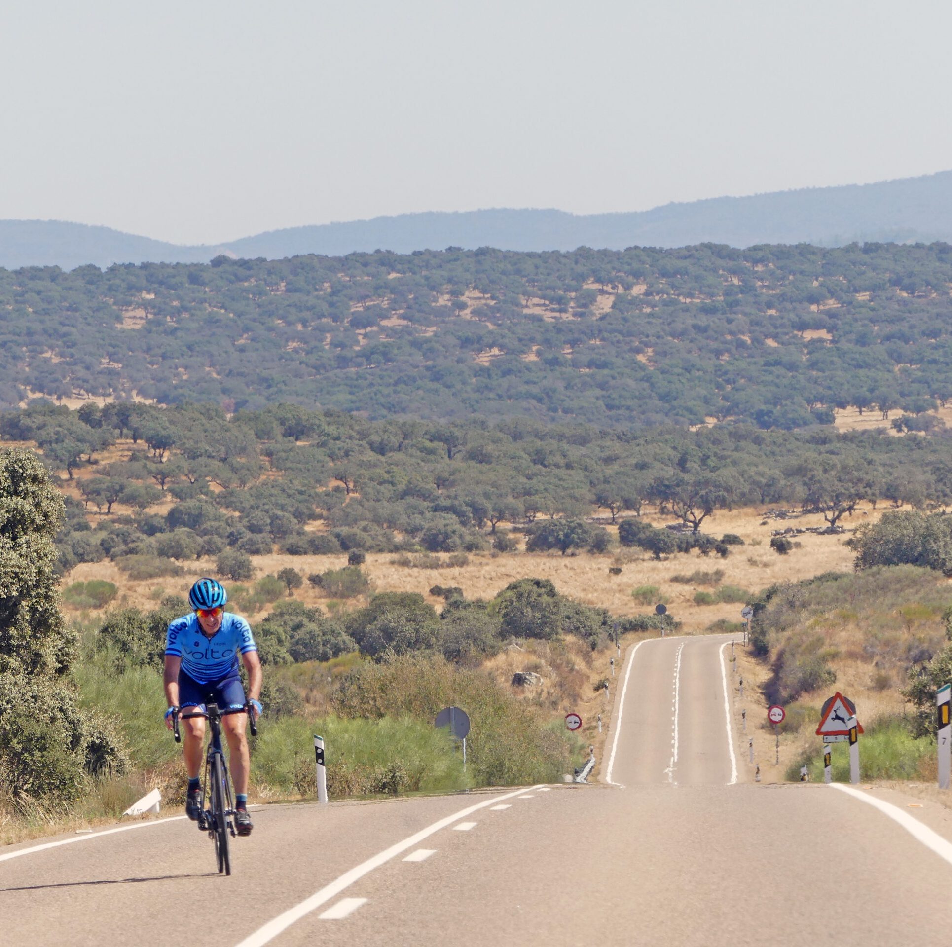 Endless Horizons – Trans Iberian 600k Solo cyclist riding across the Spanish plains with an endless road stretching behind.