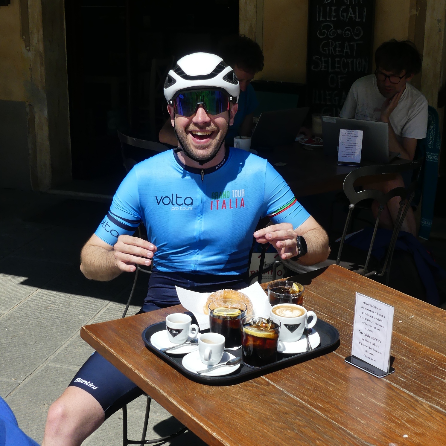 Coffee Break in the Heart of Italy – Grand Tour Italia: Marche & Abruzzo Cyclist enjoying a quiet coffee break at a local café during the Grand Tour Italia: Marche & Abruzzo.